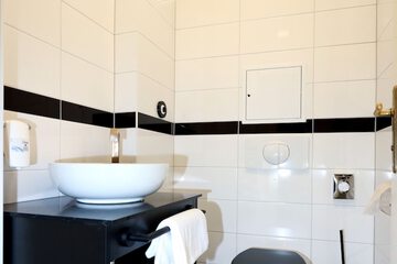 Raised toilet seat