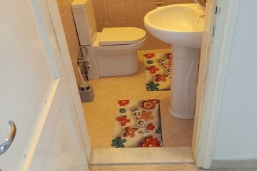 Raised toilet seat