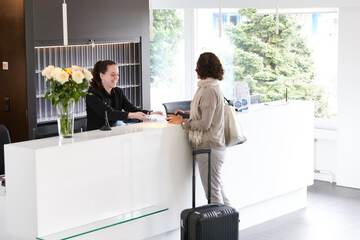 Check-in/check-out kiosk