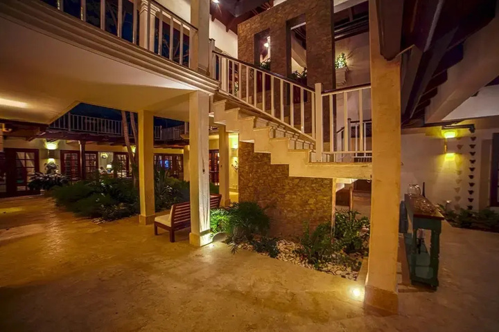 Exterior of Golf and Beach Resort Villa With Beautiful Sunsets Pool Golf Cart and Service Staff