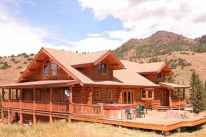 Exterior of on the Creek 5 Br home by RedAwning