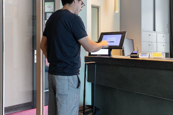 Check-in/check-out kiosk