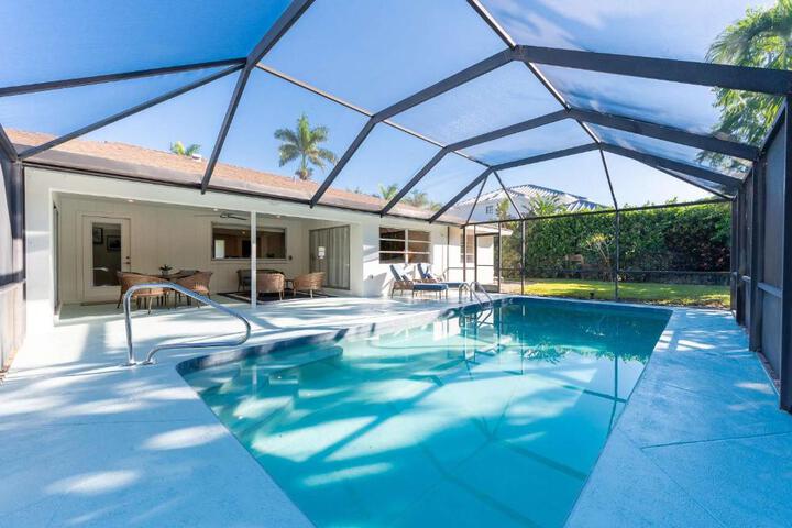 Image of Pesaro - stylish 3BR retreat near Via Miramar Beach beautifully renovated home with a private pool, lush tropical gardens and premium modern comforts, perfect for families and relaxing getaways, just minutes from sandy beaches and vibrant downtown Naples