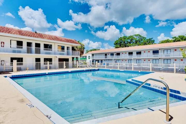 Photo of Condo Hotel with double bed and community pool miles from Disney