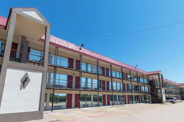 Exterior of Magnuson Extended Stay and Suites Airport Hotel