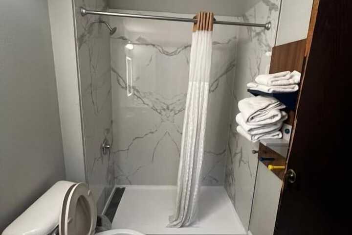 1 King Bed Mobility Accessible Roll in Shower (1 of 6)