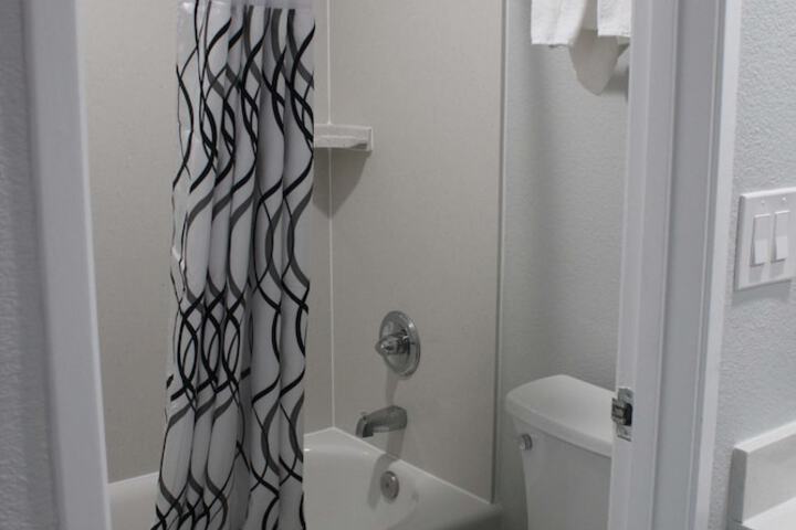 1 King Bed Flat Screen Television Microwave and Refrigerator High Speed Internet Accessible (7 of 10)