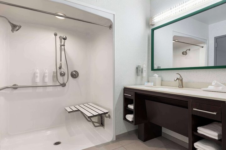 1 King Mobilty Hearing Accessible Roll in Shower Suite (1 of 8)