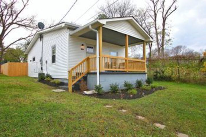 Exterior of Germantown House with Fenced Yard by RedAwning