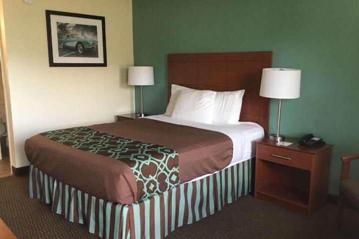 1 Queen Bed Microwave and Refrigerator Flat Screen Television High Speed Internet Accessible Table and Chairs Coffee Maker Continental Breakfast (4 of 4)