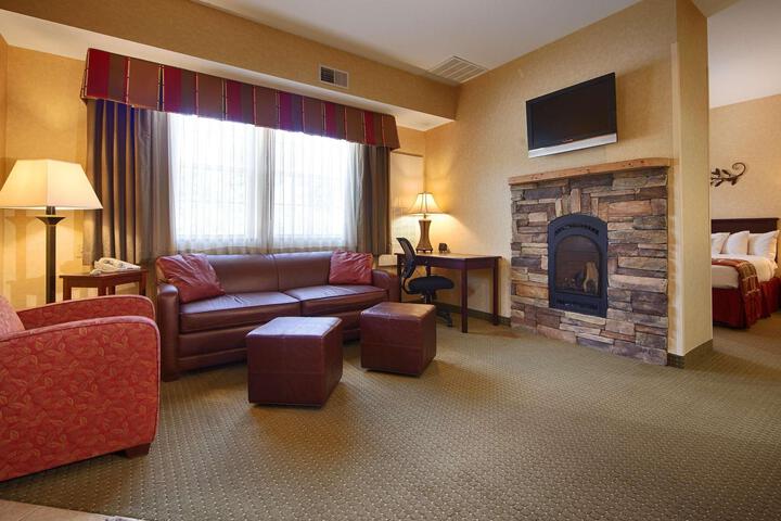 Suite 1 King Bed 2 Room Suite Queen Sofa Bed Microwave and Refrigerator Living Room Continental Breakfast (8 of 12)
