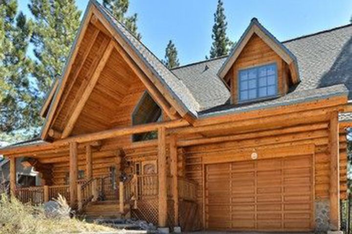 Exterior of 3BR Custom Handmade Log Home by RedAwning