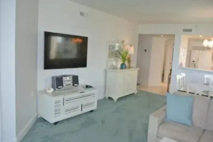 Image of Deluxe Beachfront Condo Located in Prestigious Resort with Pool and Hot Tub by RedAwning