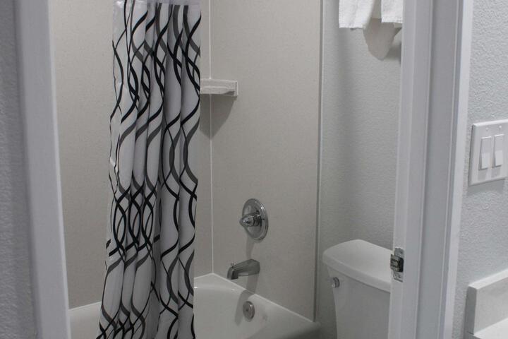 1 King Bed Flat Screen Television Microwave and Refrigerator High Speed Internet Accessible (8 of 10)