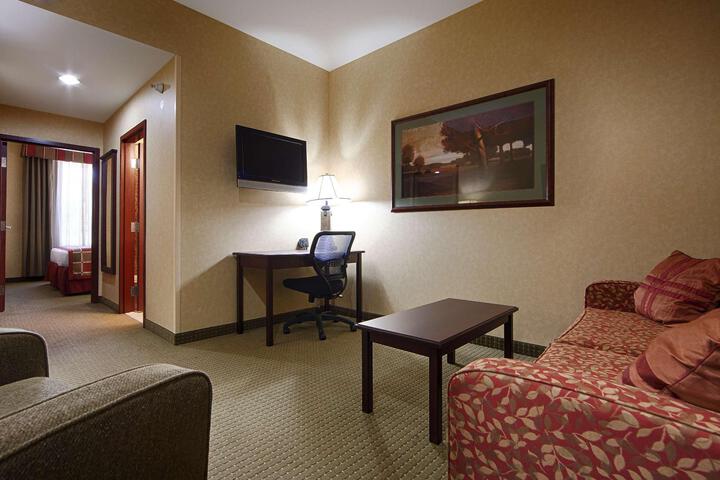 Suite 1 King Bed 2 Room Suite Queen Sofa Bed Microwave and Refrigerator Living Room Continental Breakfast (1 of 12)