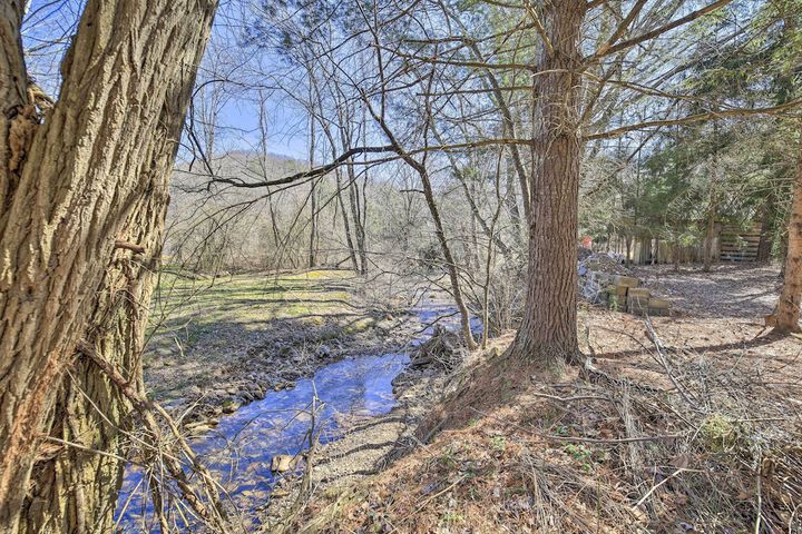 Quaint Creekside Home w / Spacious Deck & Yard
