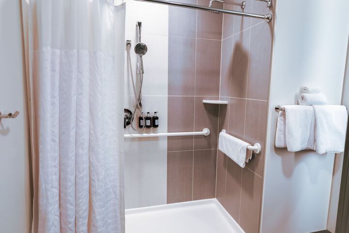 1 King Bed Hearing Accessible Room Roll in Shower Track View (5 of 15)