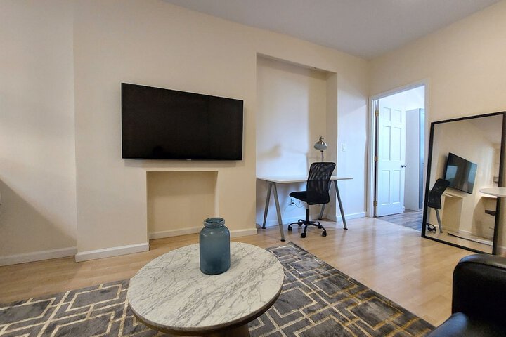 Image of Comfortable Apartment with Kitchen and Work Station