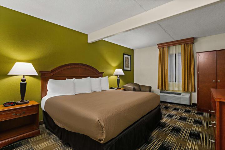 1 King Bed Junior Suite Microwave and Refrigerator WiFi Shower Only Continental Breakfast (10 of 19)