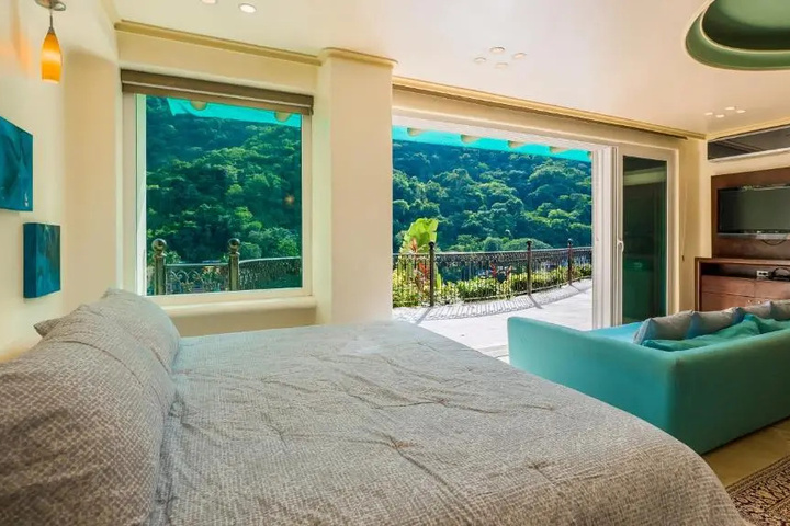 Exterior of Luna Suite with two king size beds with walk out terrace overlooking the beach