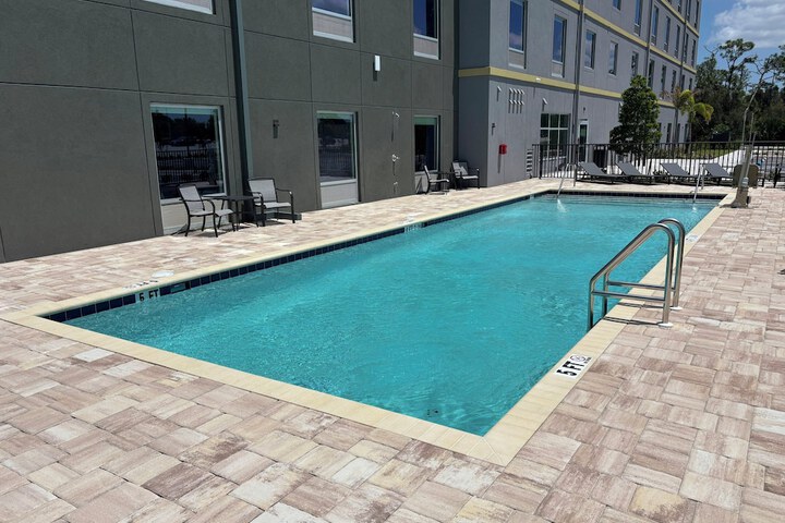 Pool image of HomeTowne Studios by Red Roof Fort Myers
