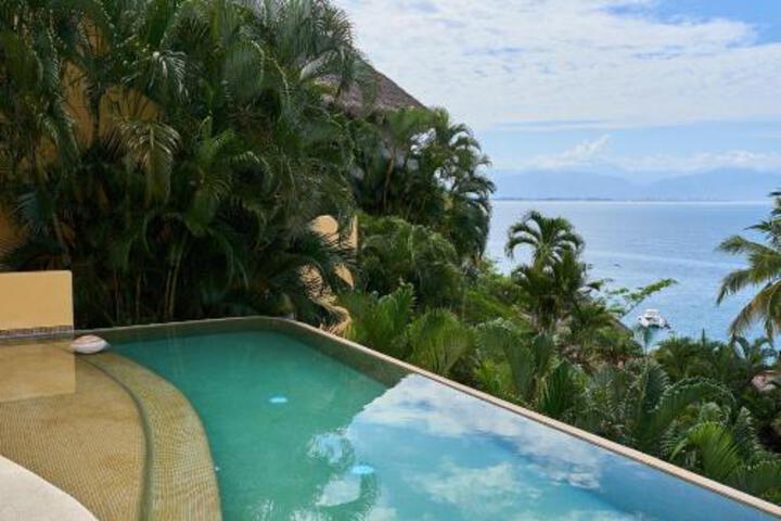 Exterior of The beach is calling Big Beach house with all around ocean views in five star beachfront resort