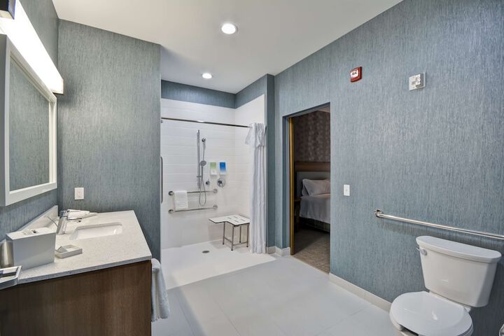 1 King Mobilty Hearing Accessible Roll in Shower Suite (8 of 17)
