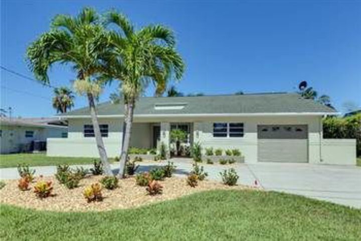 Exterior of Cutlass Cove Renovated 4br on Deep Water Canal by RedAwning